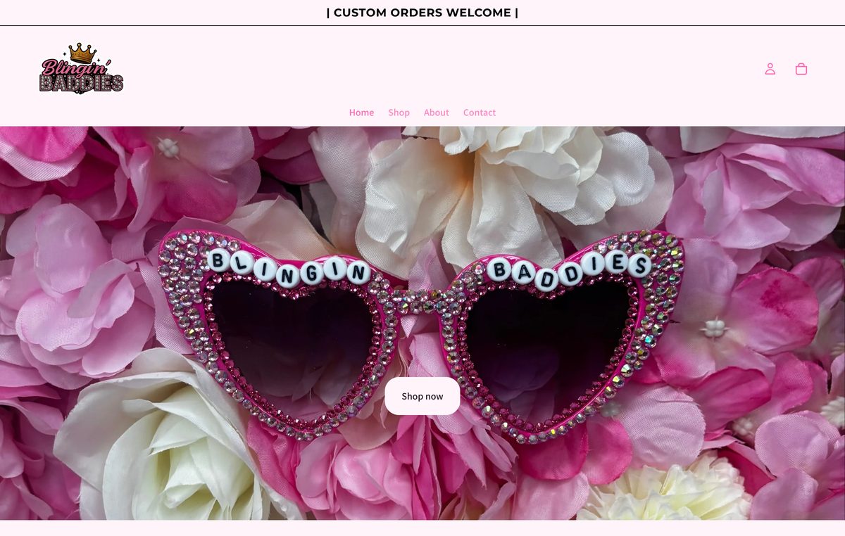blinginbaddies.com homepage with rhinestone heart sunglasses